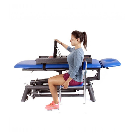 Mini Tensor – ćwiczenia kończyny górnej na urządzeniu rehabilitacyjnym w pozycji siedzącej.